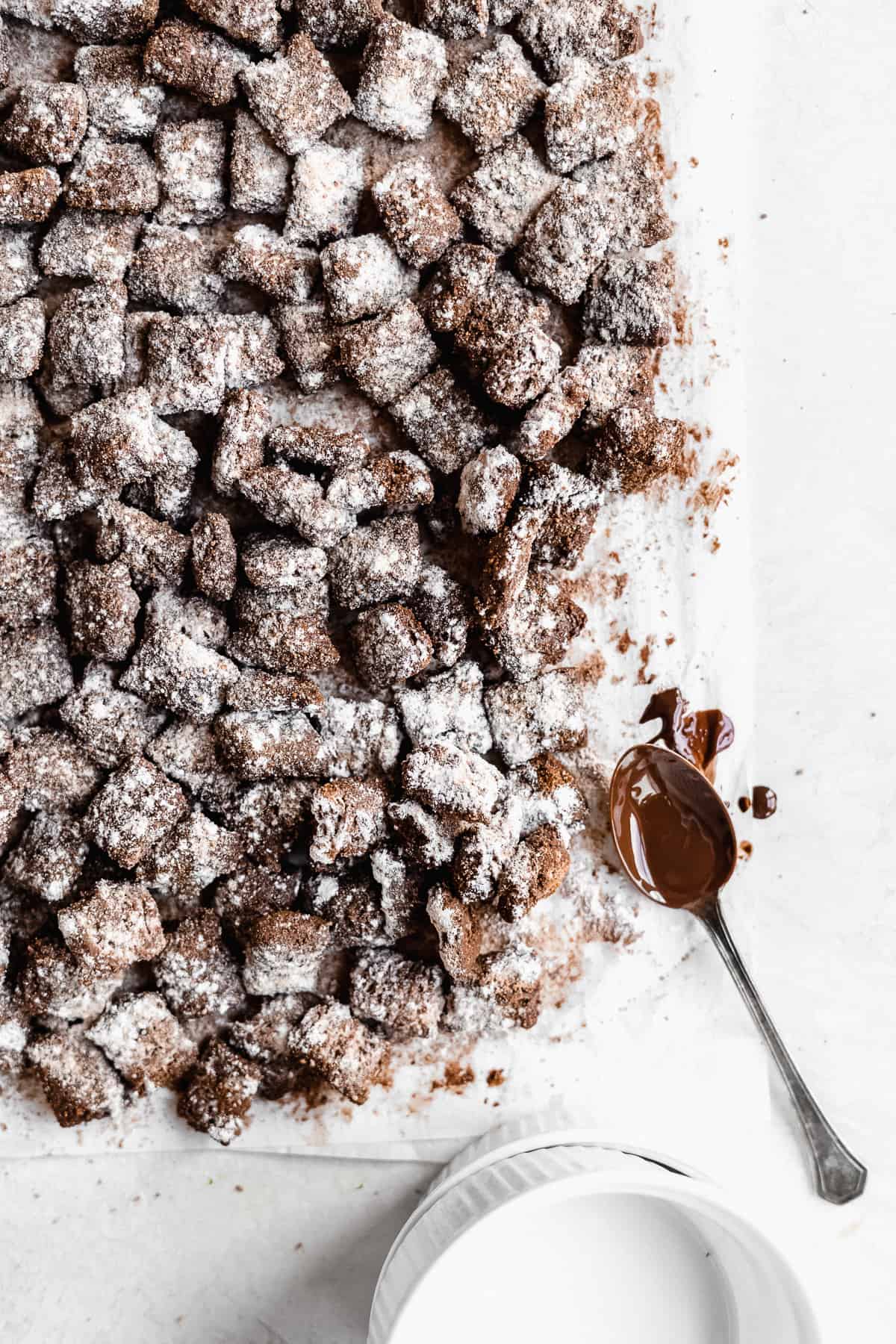 Overhead photo of Healthy Puppy Chow arranged on white parchment paper on a marble slab.  