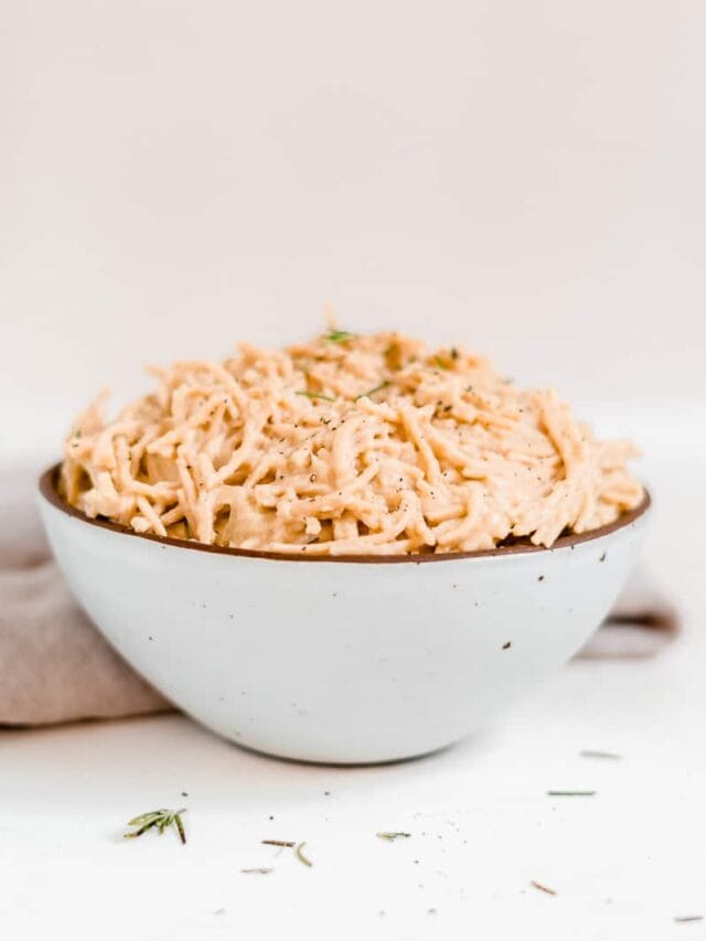 Cauliflower vegan alfredo pasta in a large white bowl.