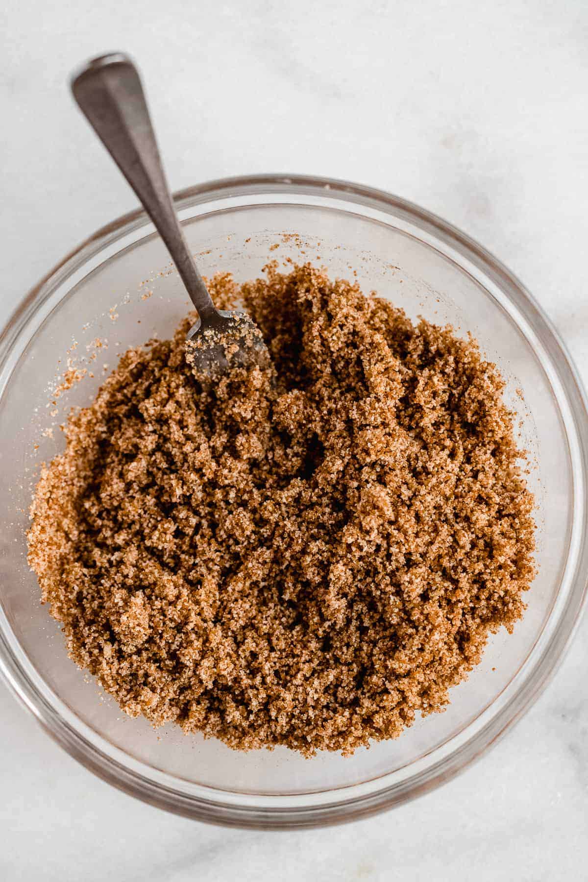 Overhead view of a bowl with cinnamon streusel.