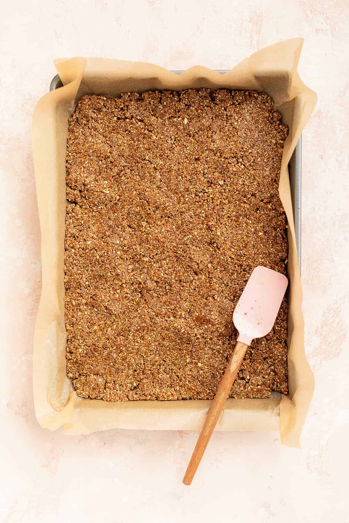 Graham cracker mixture in a baking pan.