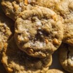 Up close view of butterscotch cookies with flaky sea salt.