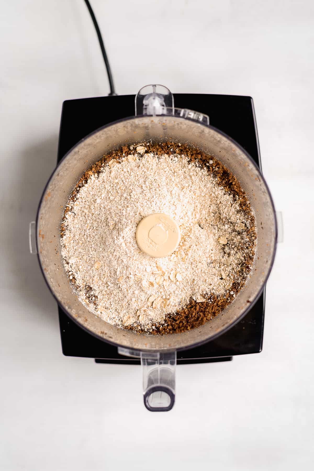 Oat flour about to be mixed into a food processor.