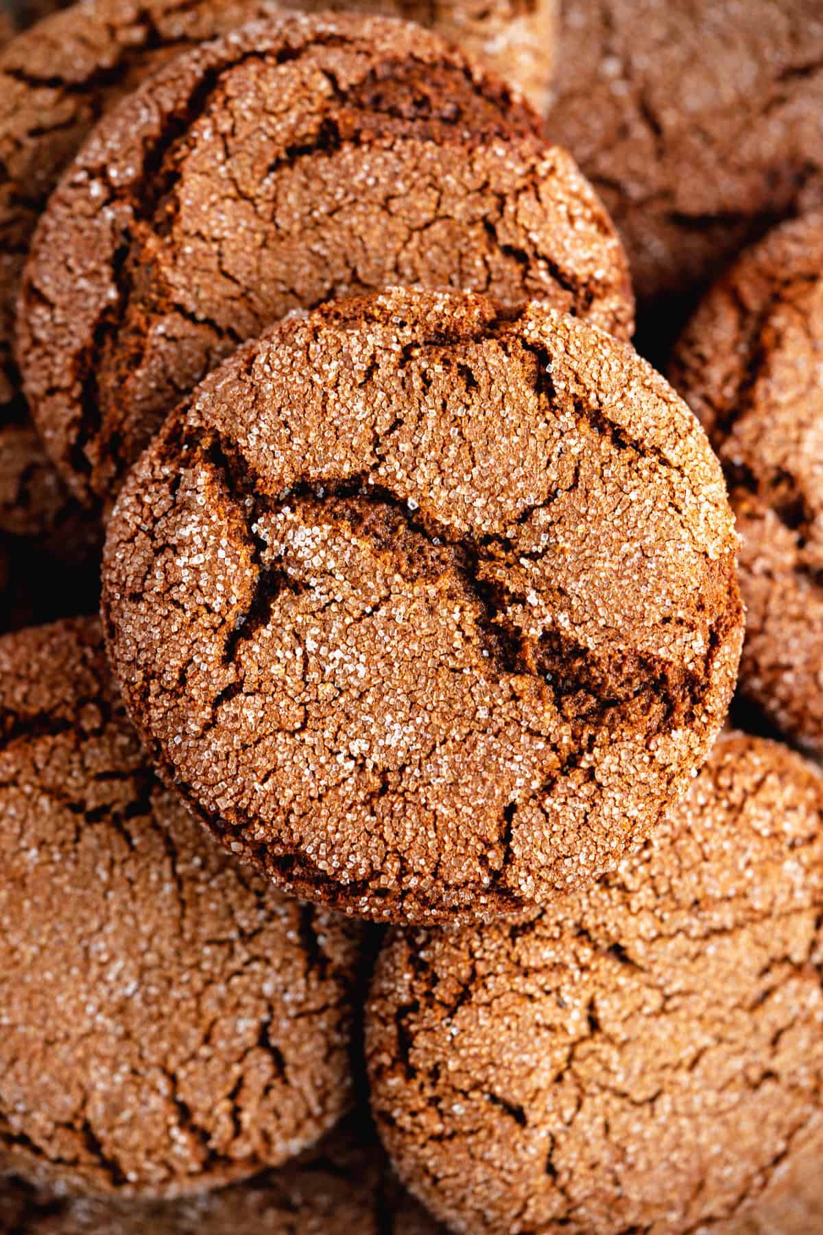 Closeup photo of a plate of Soft and Chewy Ginger Snap Cookies that highlights the texture and inside of each cookie.  