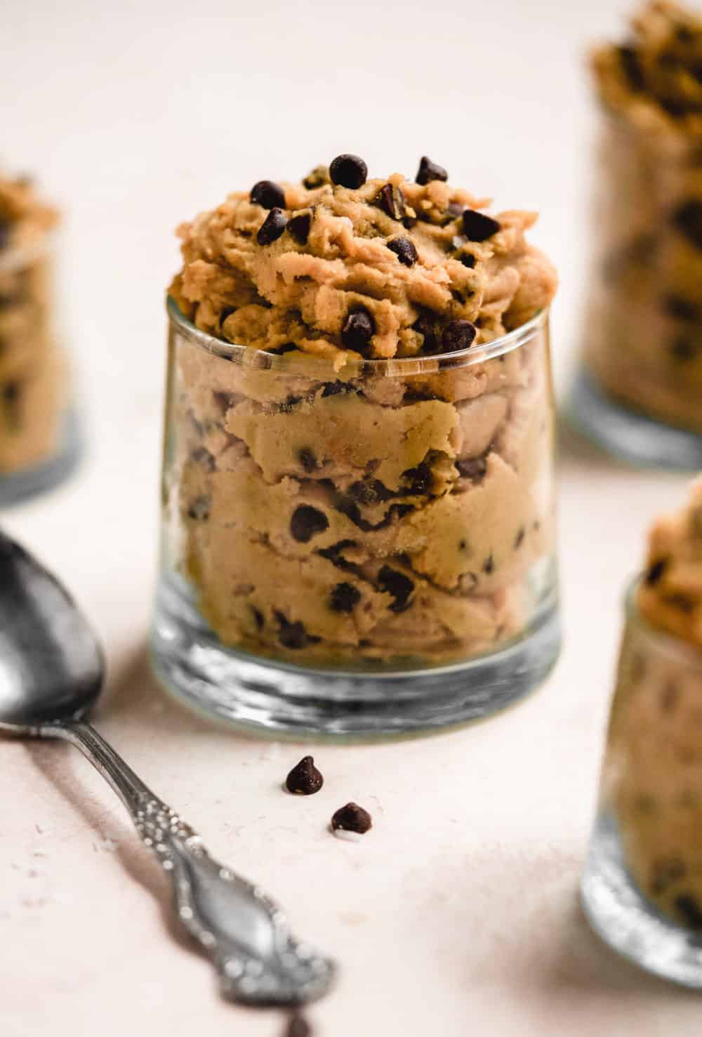 Small glass filled with edible cookie dough.