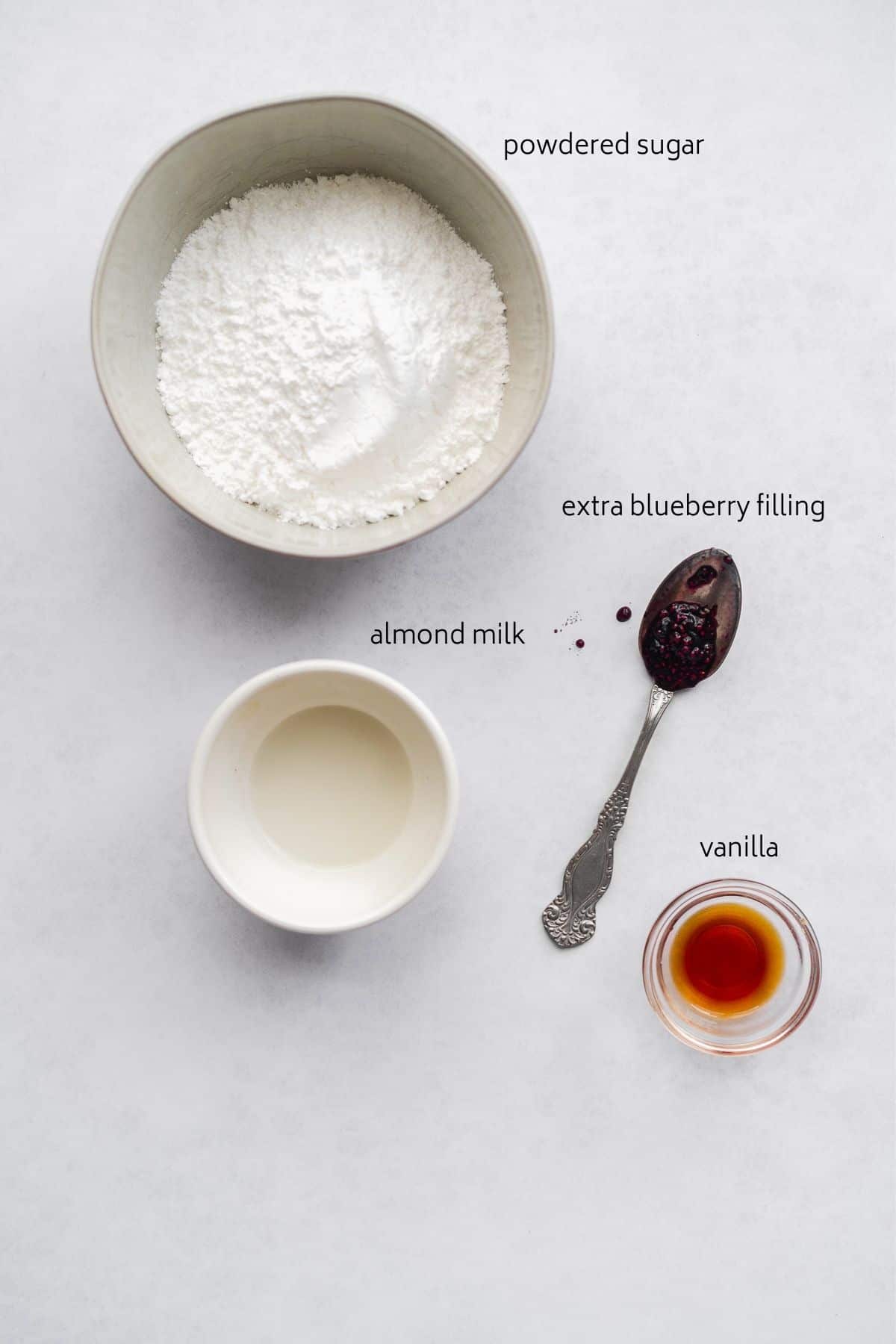 Blueberry filling ingredients on white surface.