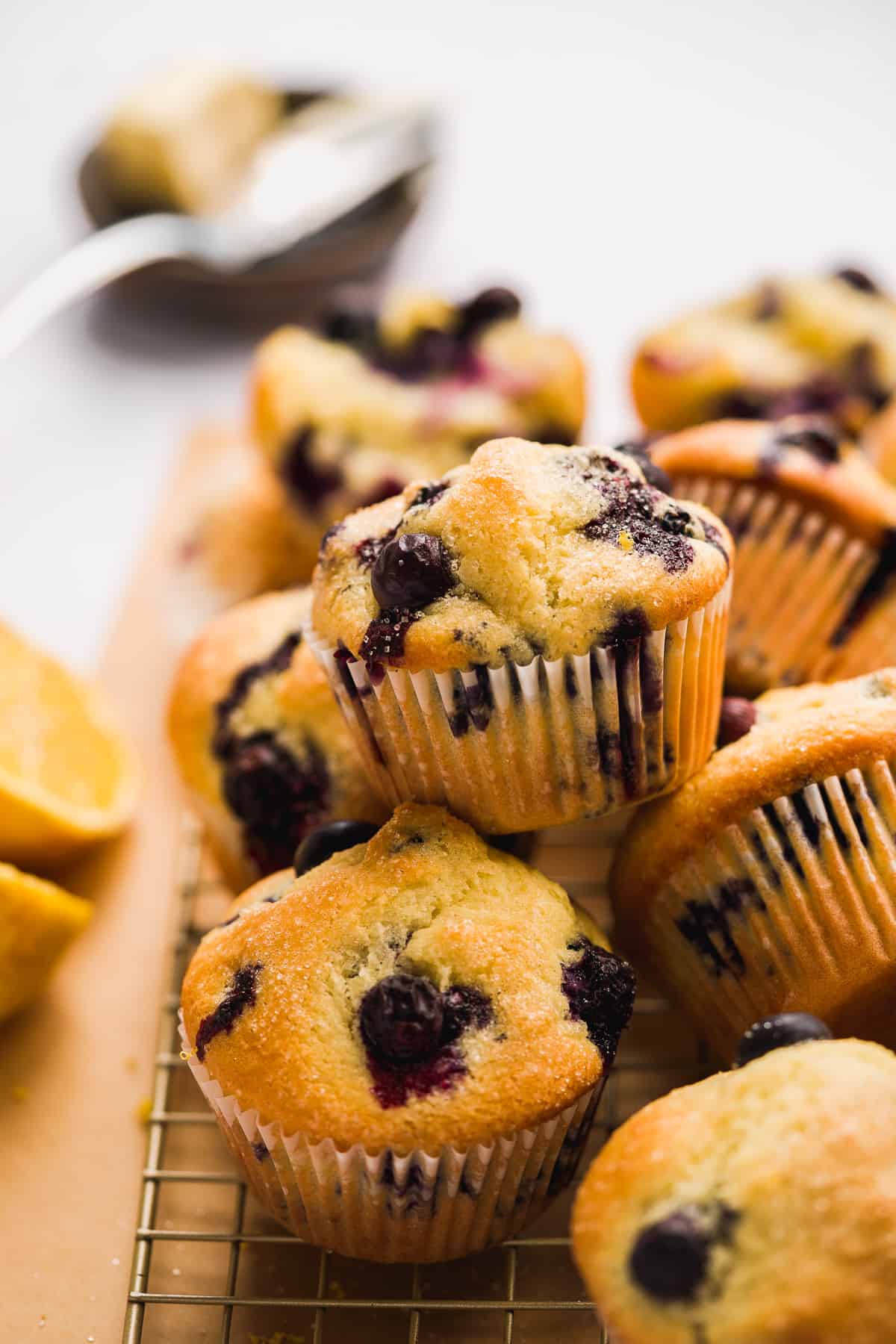 Stack of blueberry muffins on a wire rack.