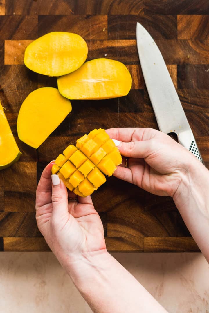 Mango segment cut into cubes.
