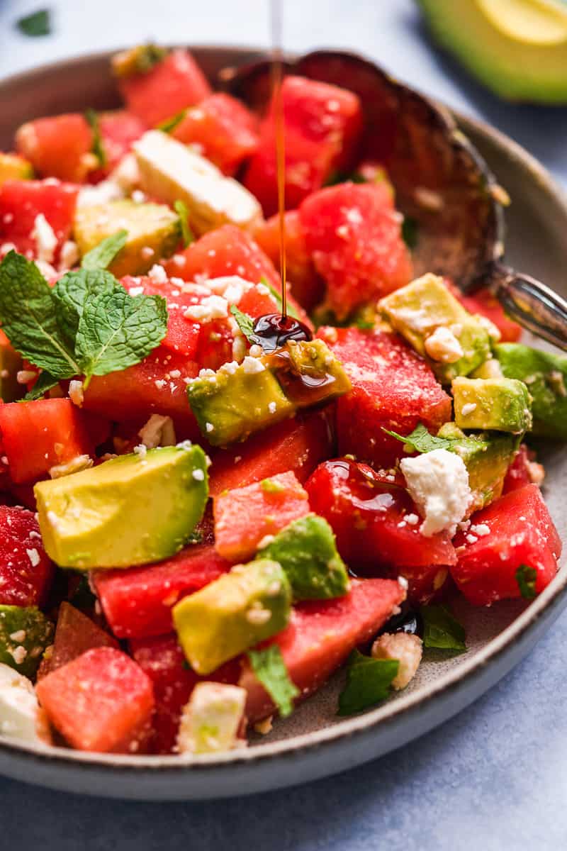 watermelon feta mint salad in a bowl with serving spoon