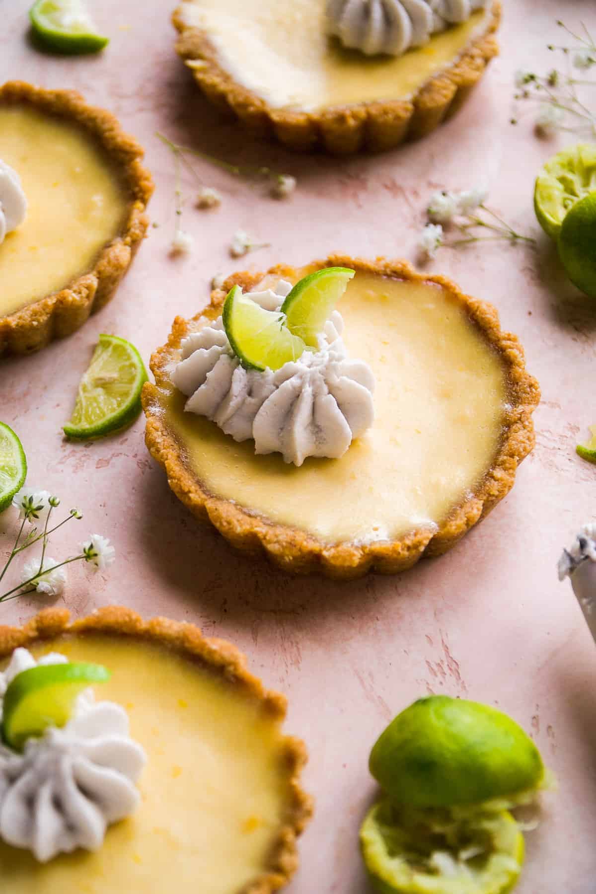 Gluten free key lime pie tarts with whipped cream.