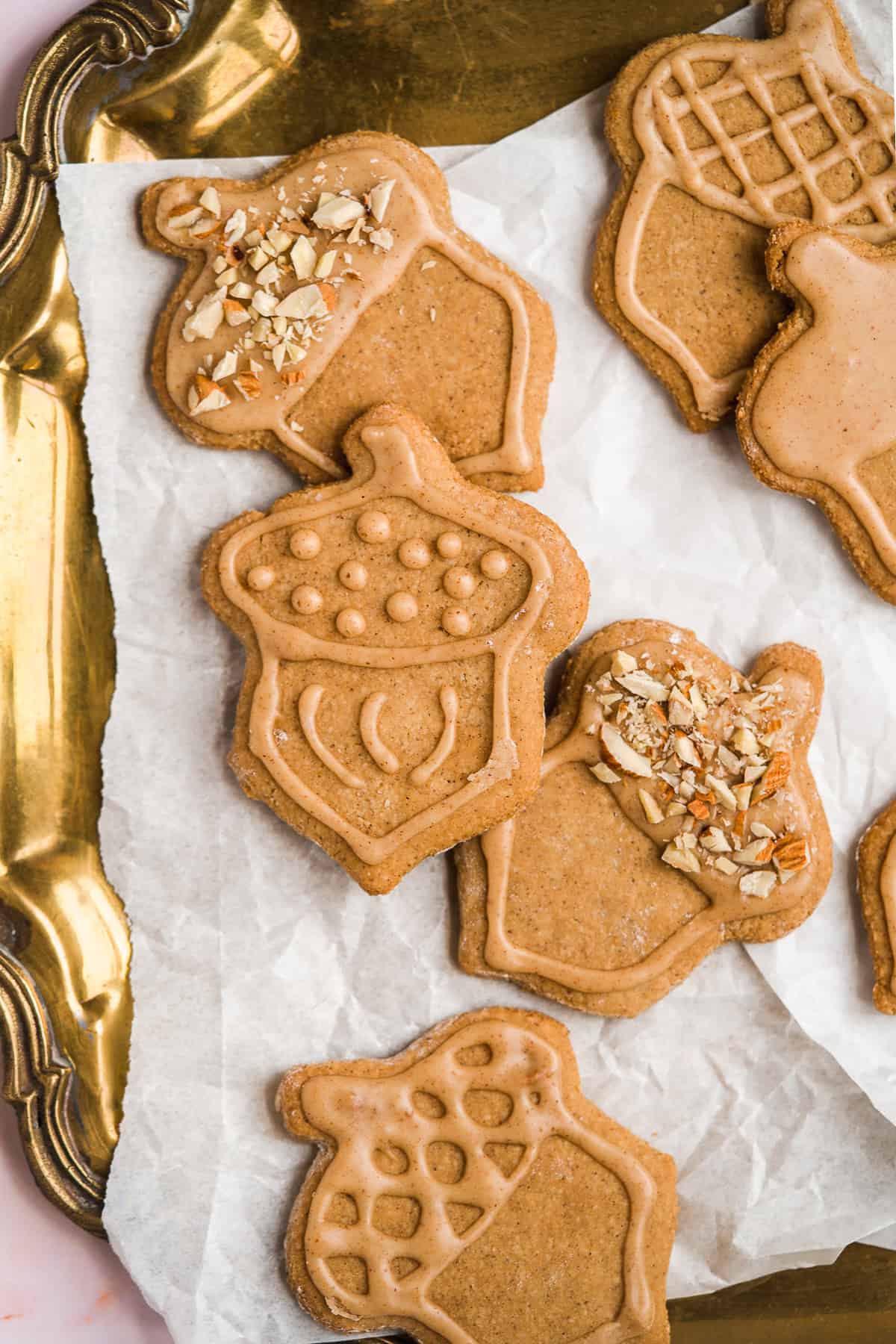 With hints of maple and nutty flavor, these almond flour peanut butter sugar cookies have all the warm and cozy feels in every bite. They're buttery soft and chewy with a classic cut-out sugar cookie texture. Each one is laced with a peanut butter infused royal icing that will truly rock your world.
