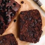 Double chocolate banana bread sliced on parchment paper