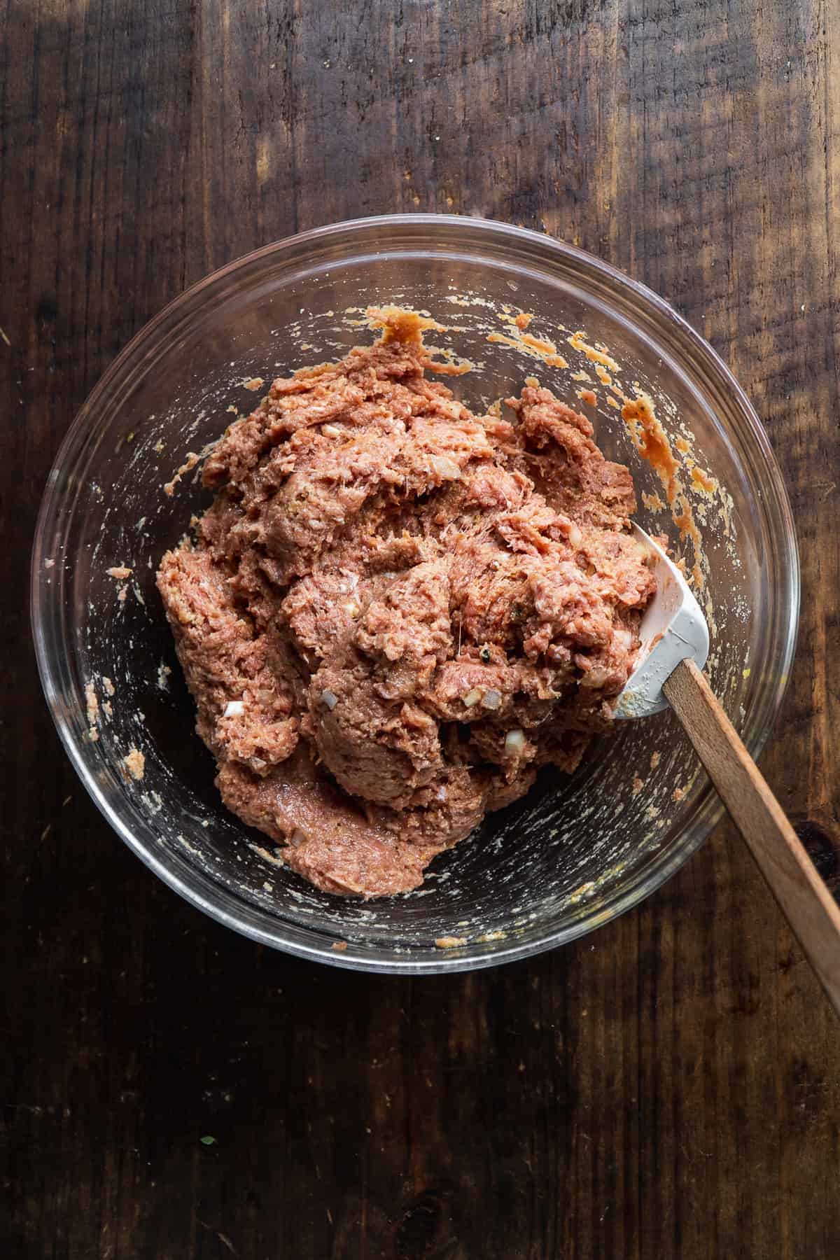 Turkey meatball mixture in a glass bowl.