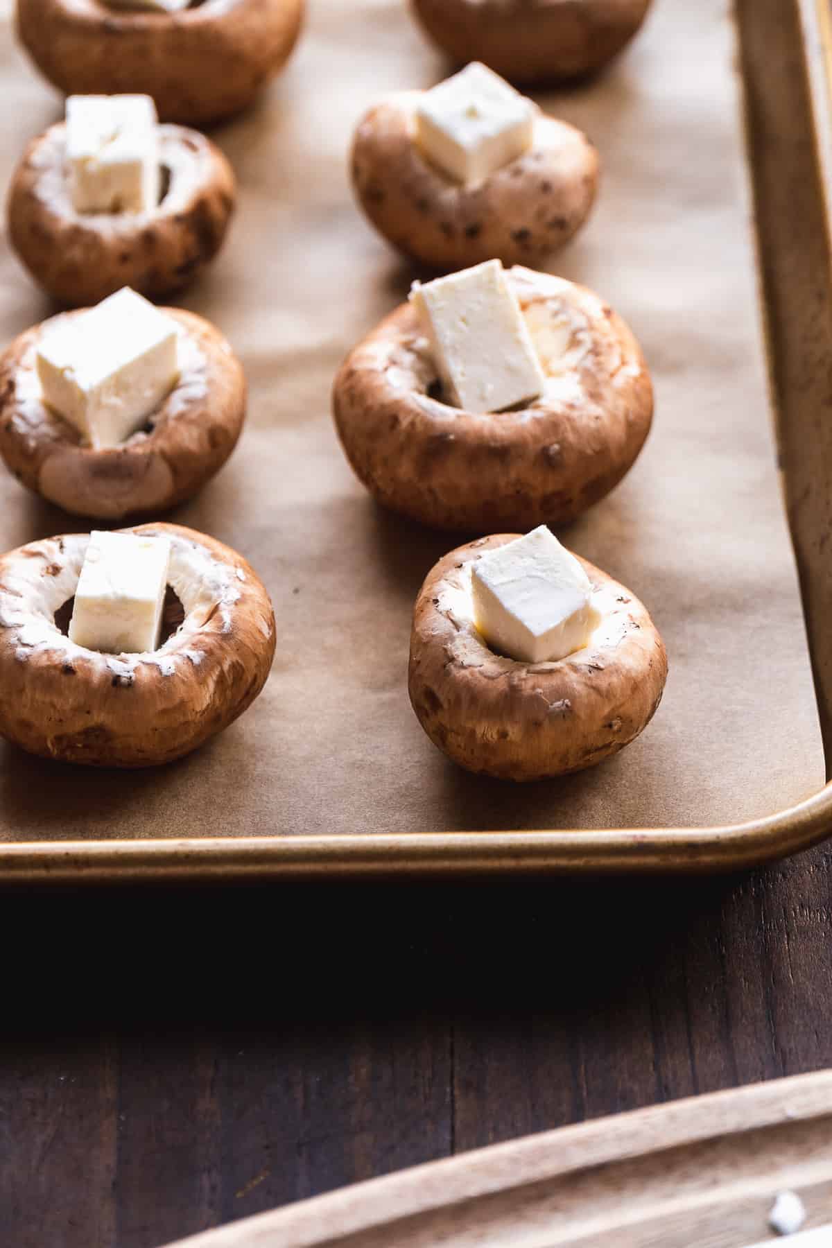 Mushrooms with a piece of feta stuffed inside.