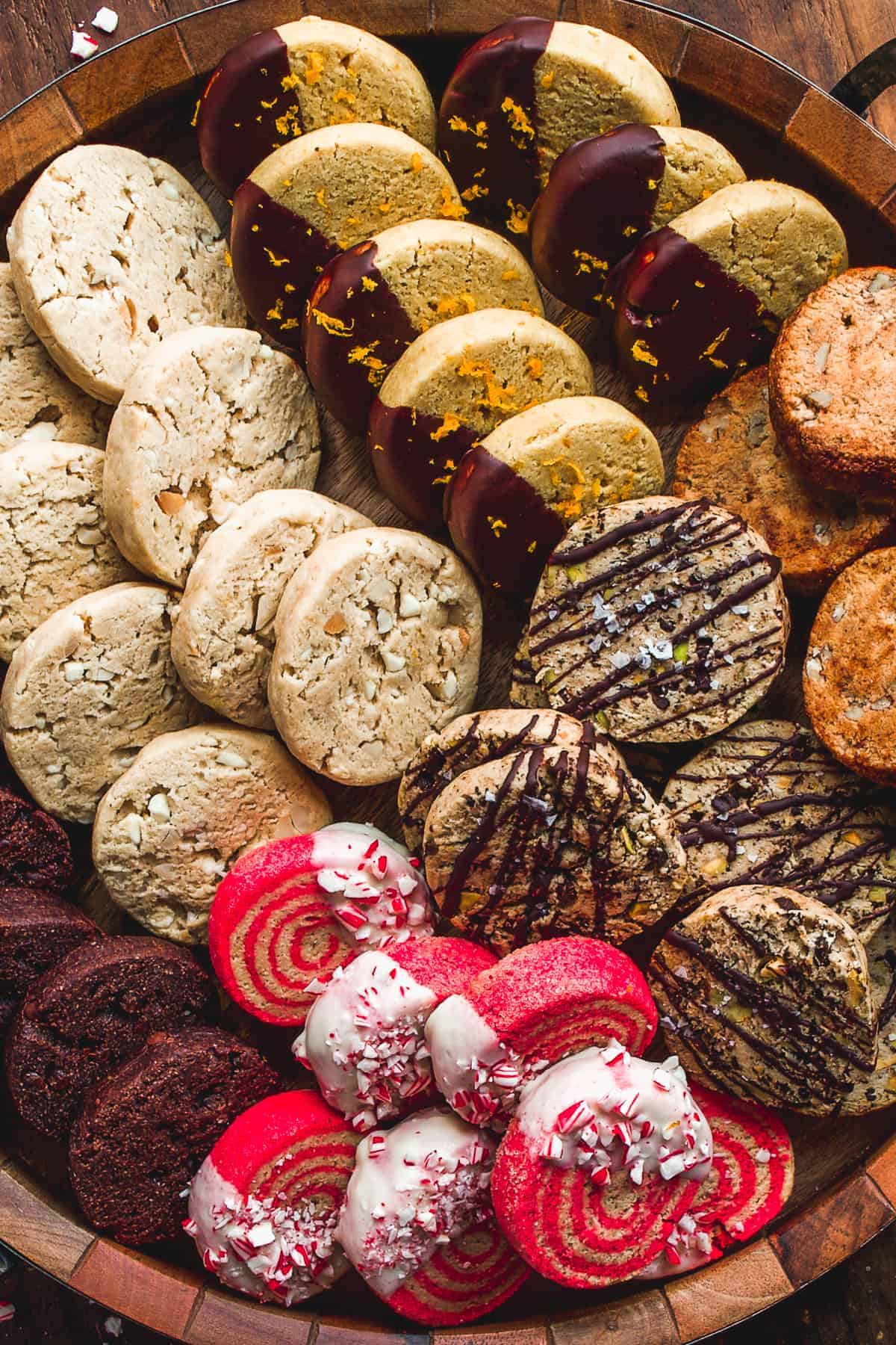 Up close view of decorated holiday cookies on a tray.