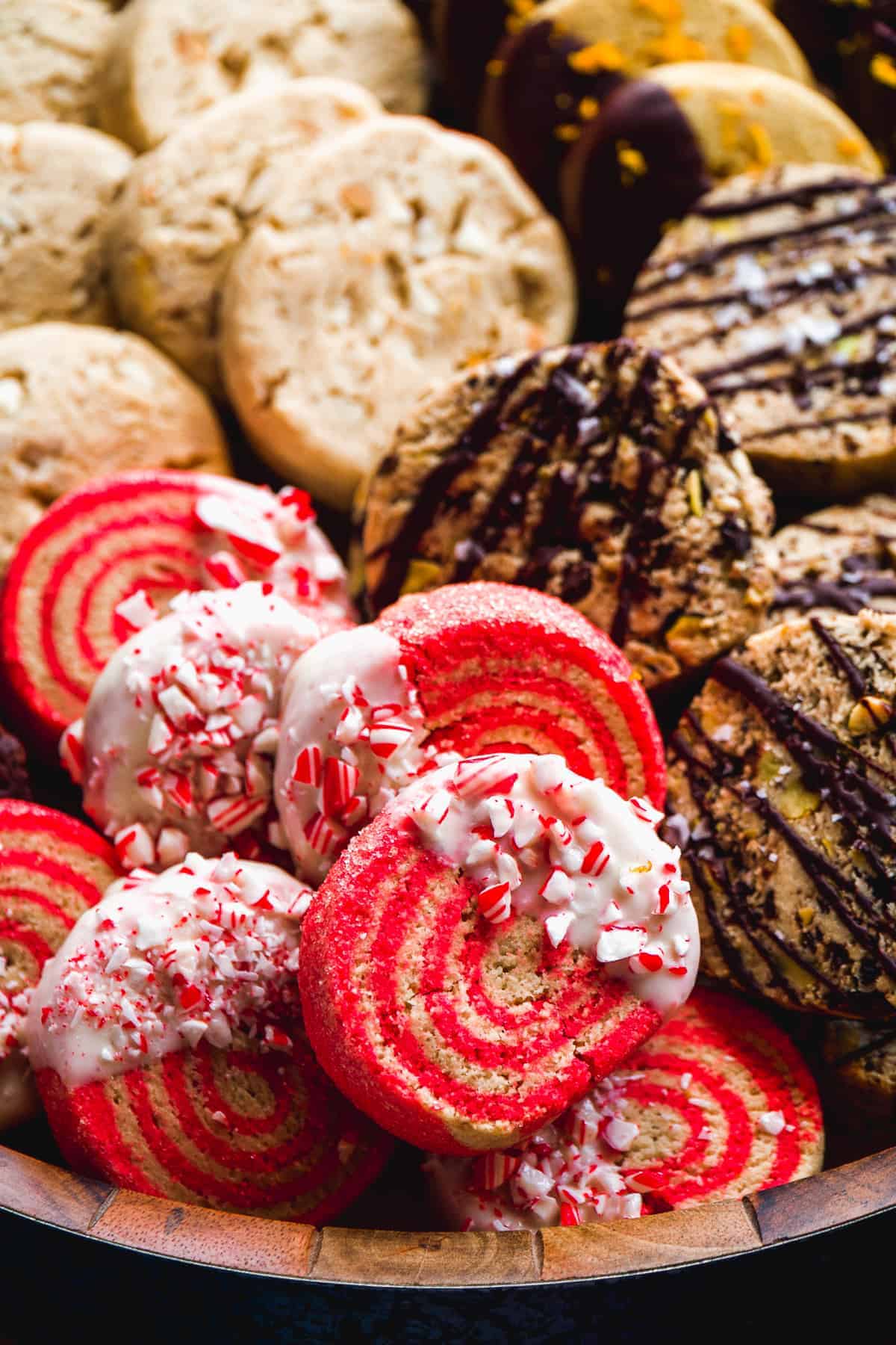 Up close view of a peppermint slice and bake cookie dipped in white chocolate.