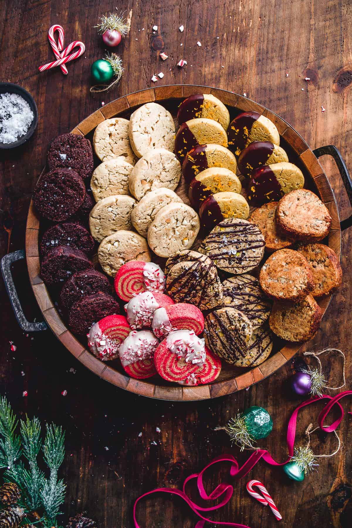 Tray full of Christmas slice and bake cookies on a wooden surface.