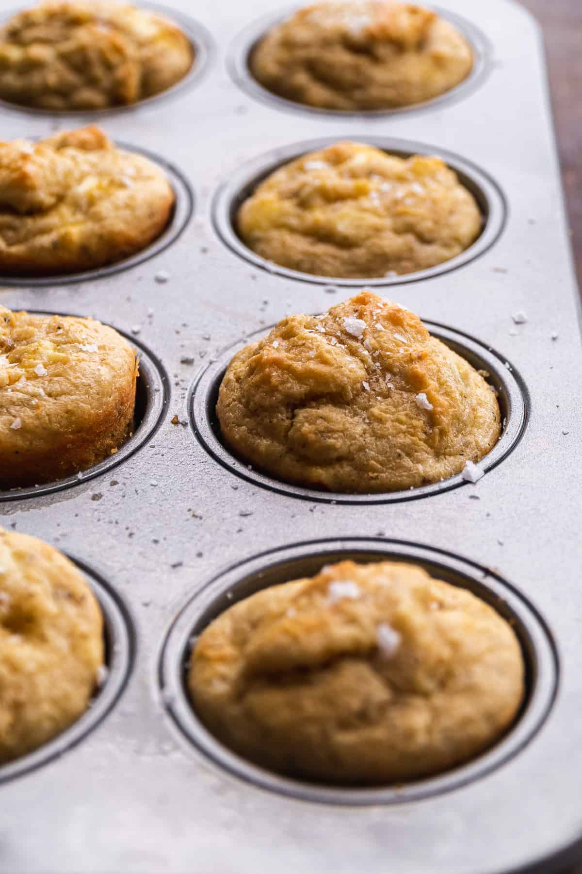 Goat cheese muffins baked in a muffin tin.