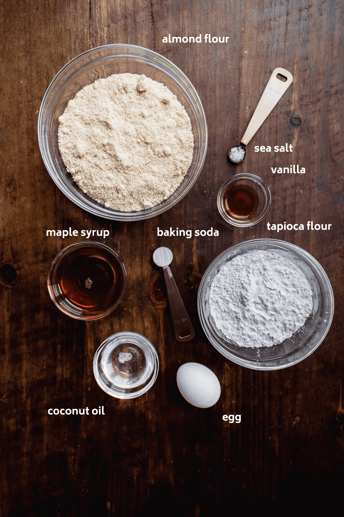 Slice and bake sugar cookie ingredients on a wooden surface.