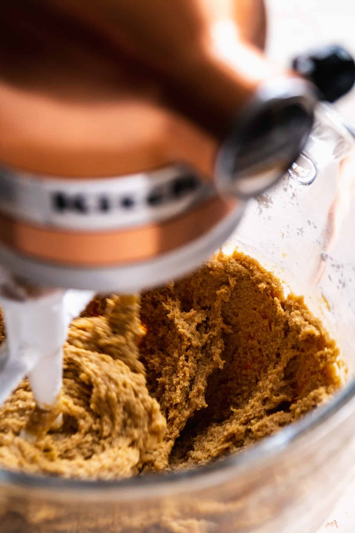 Scone batter in a large glass bowl being mixed.