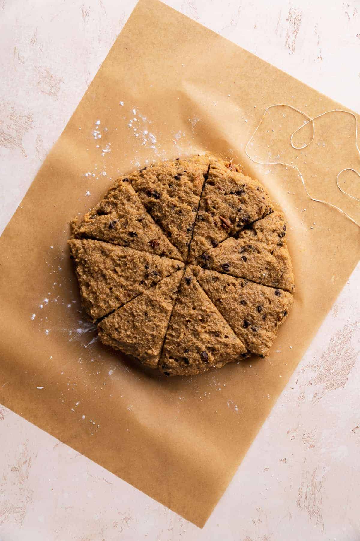 Almond flour scones on a piece of parchment paper about to be baked.