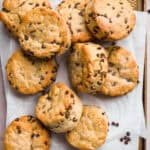 Gluten free chocolate chip biscuits on parchment paper.