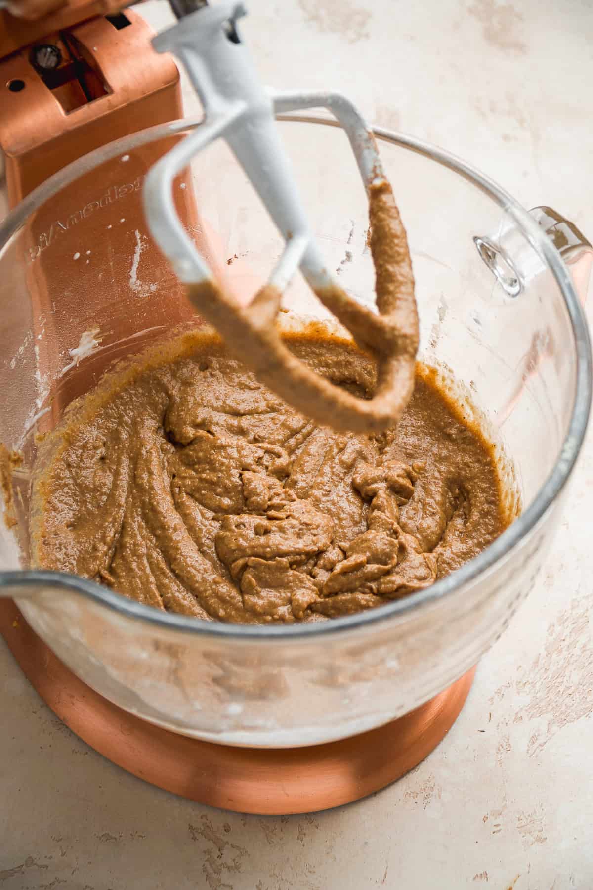 Cupcake batter in a glass mixing bowl.