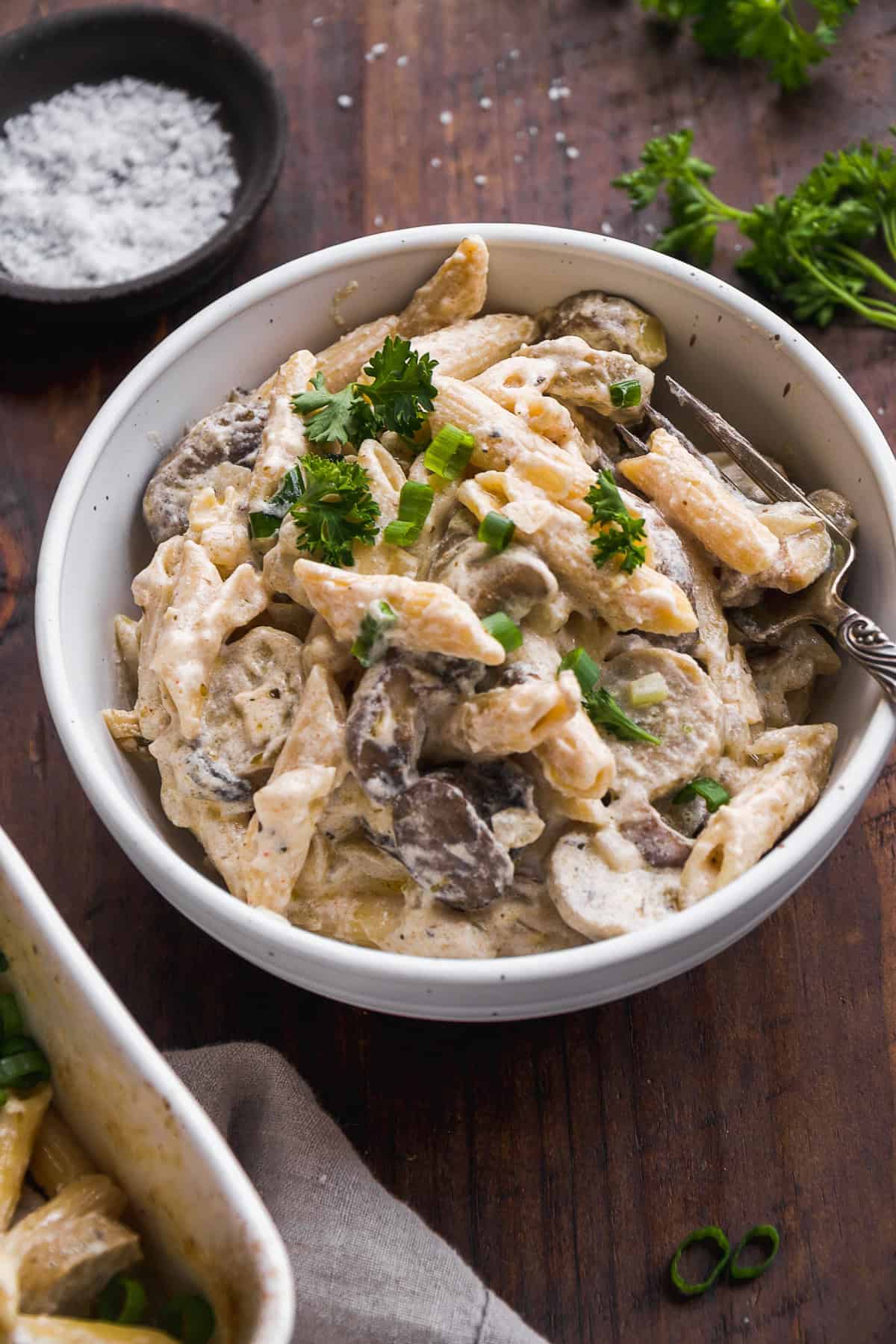 Side view of a bowl of baked goat cheese pasta.