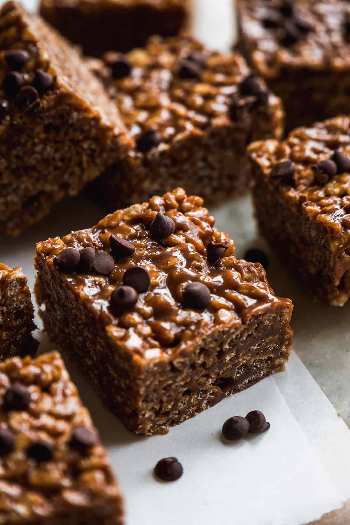 Chocolate rice krispie square with chocolate chips on top.