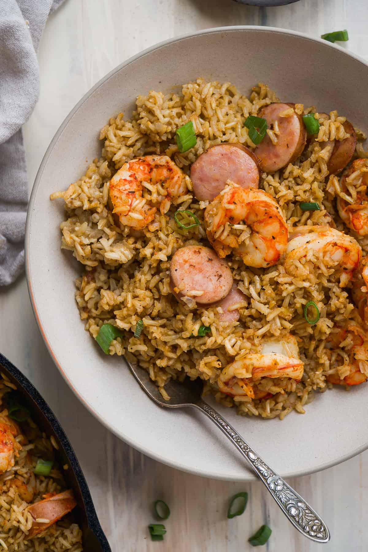 Bowl of cajun shrimp with rice and kielbasa.