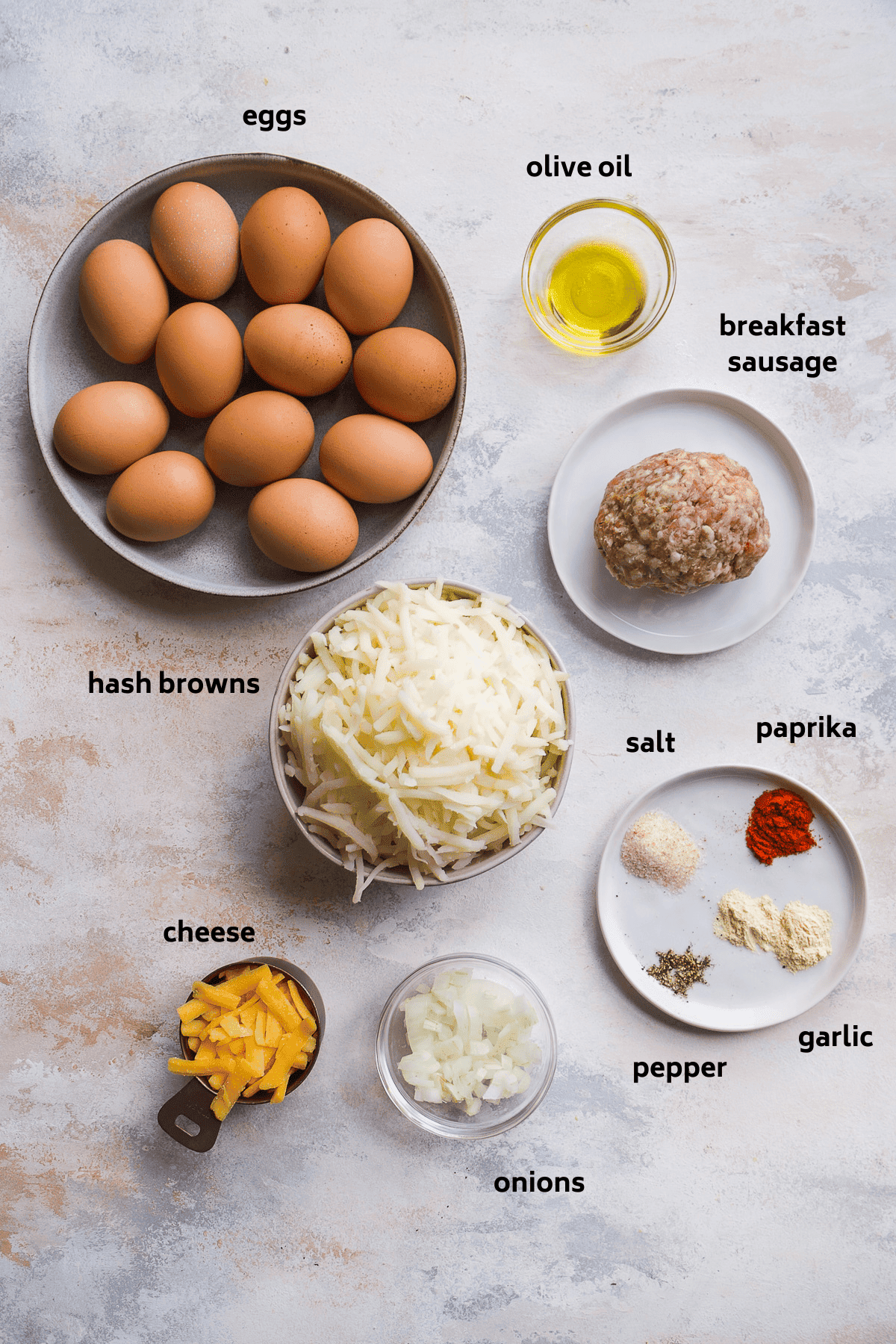 Image of hash brown egg cup ingredients on blue surface.