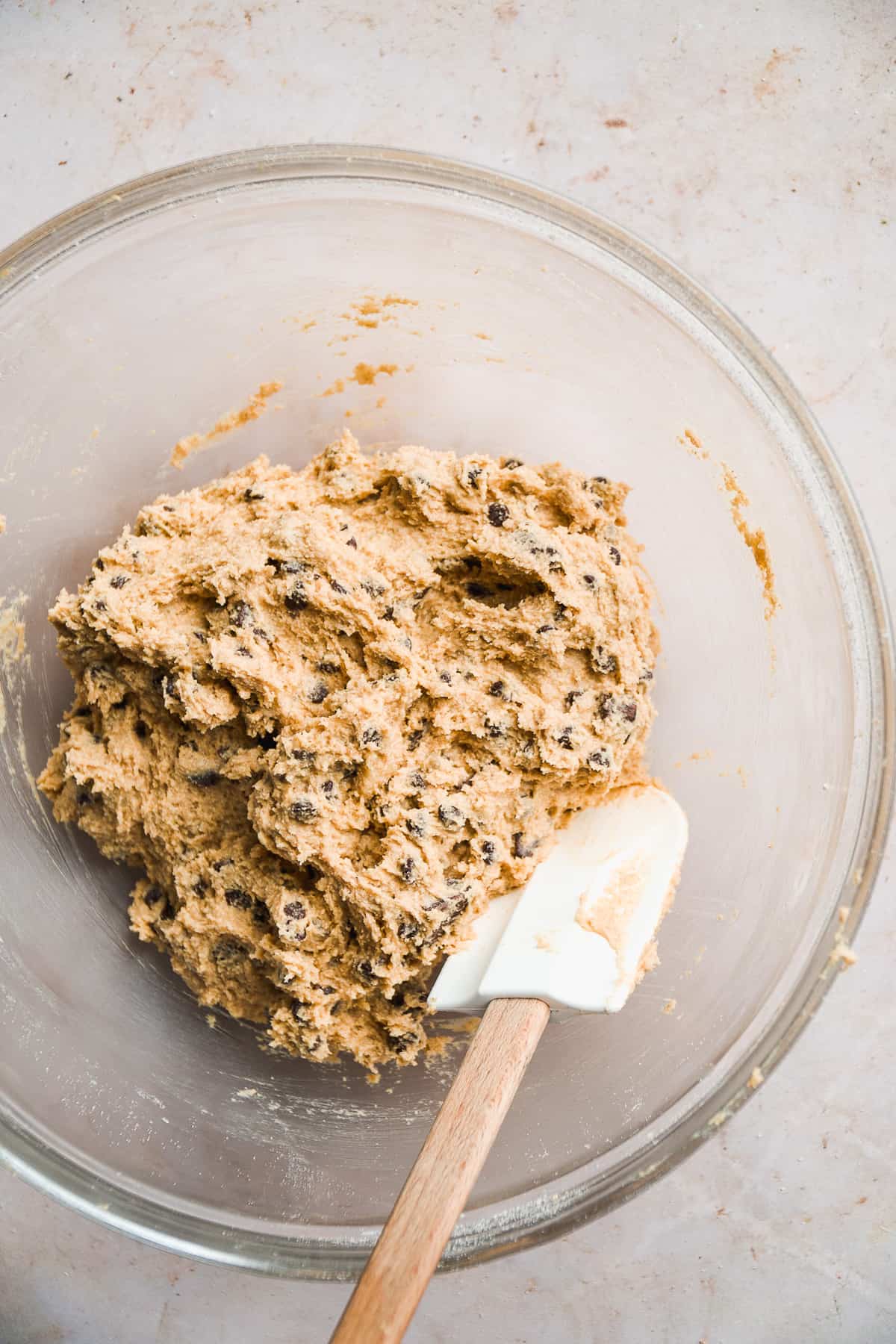 Oat four cookie dough with chocolate chips in a clear bowl.