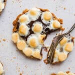 Mini s'mores pie with a fork taking a bite out of one.
