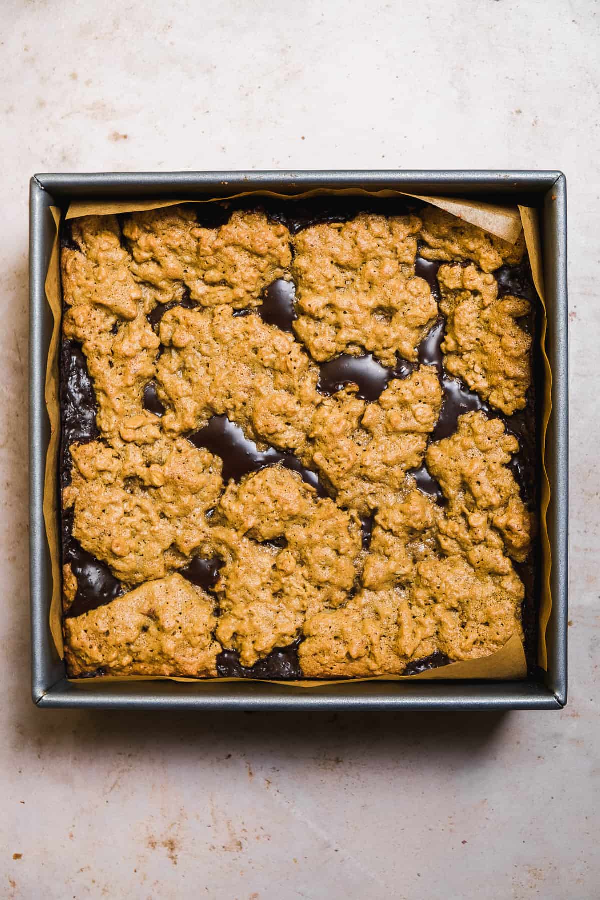 Oatmeal fudge bars baked in a square pan.