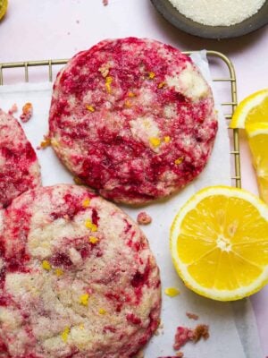 Raspberry swirled lemonade cookies on a wire rack.