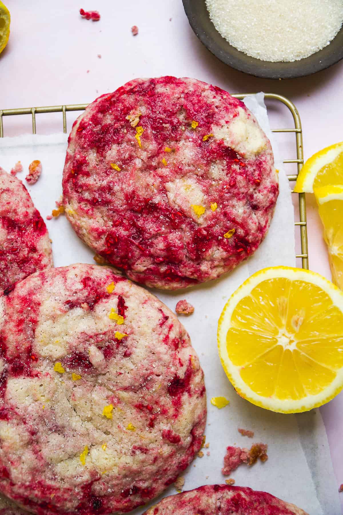 Raspberry lemonade cookies on a wire rack.