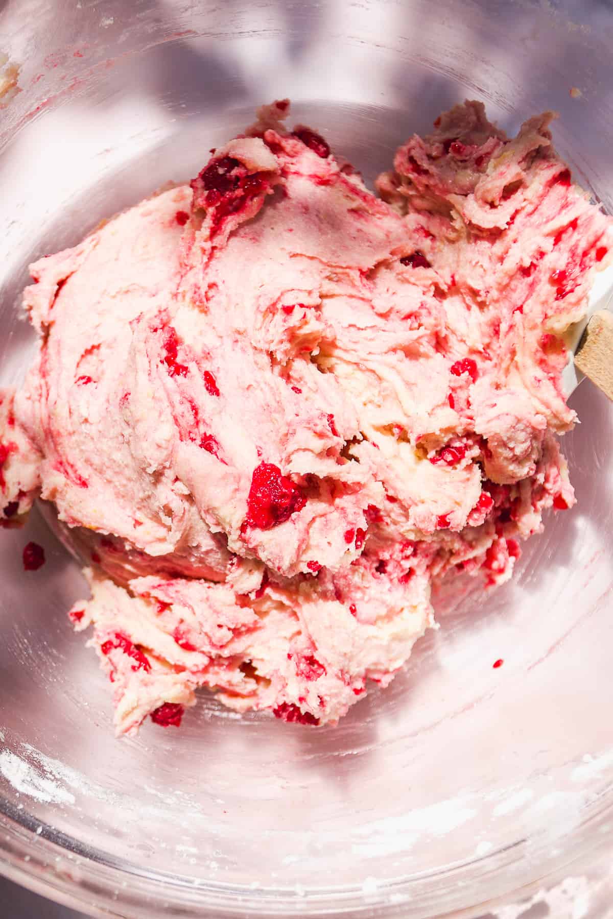 Raspberry lemonade cookie dough in a glass bowl.