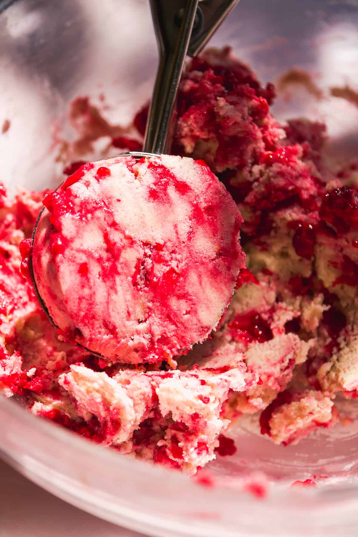 Cookie scoop with raspberry lemonade cookie dough.