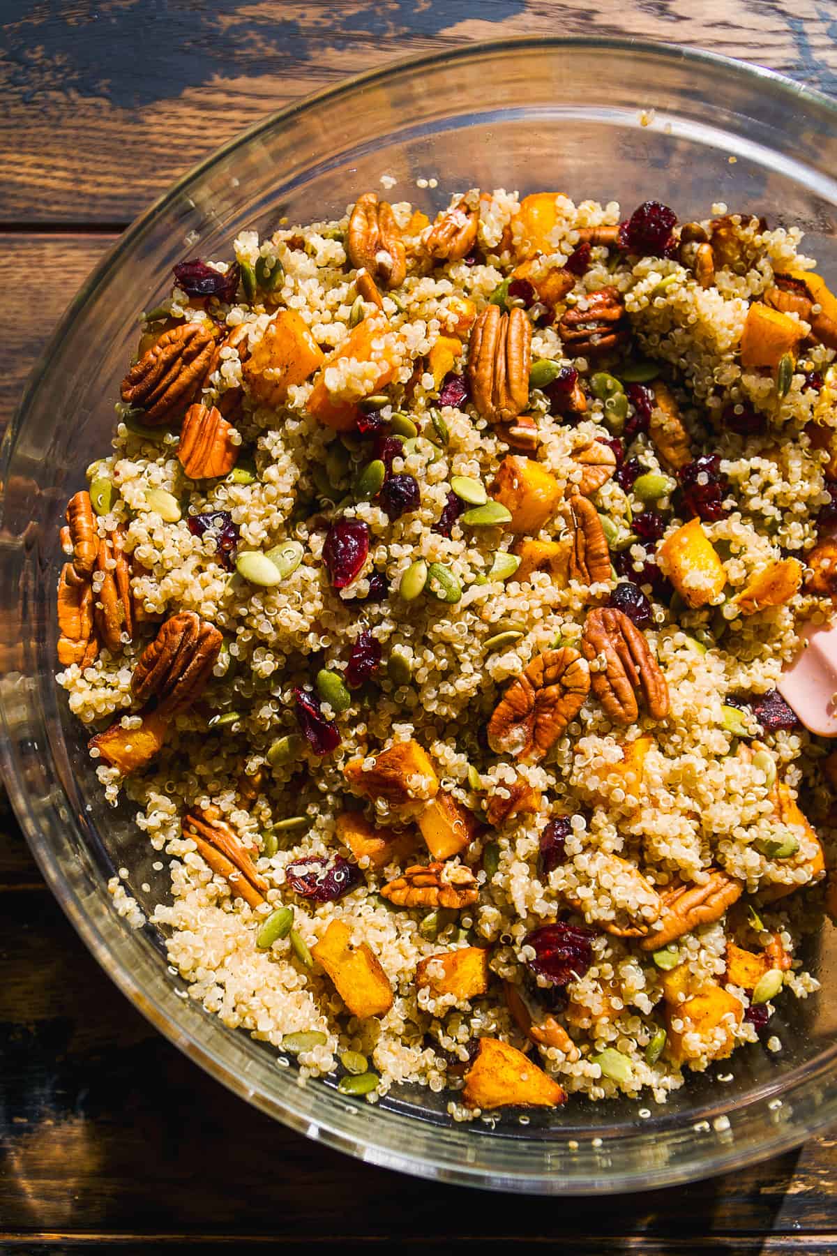 Pumpkin quinoa salad in a glass bowl.