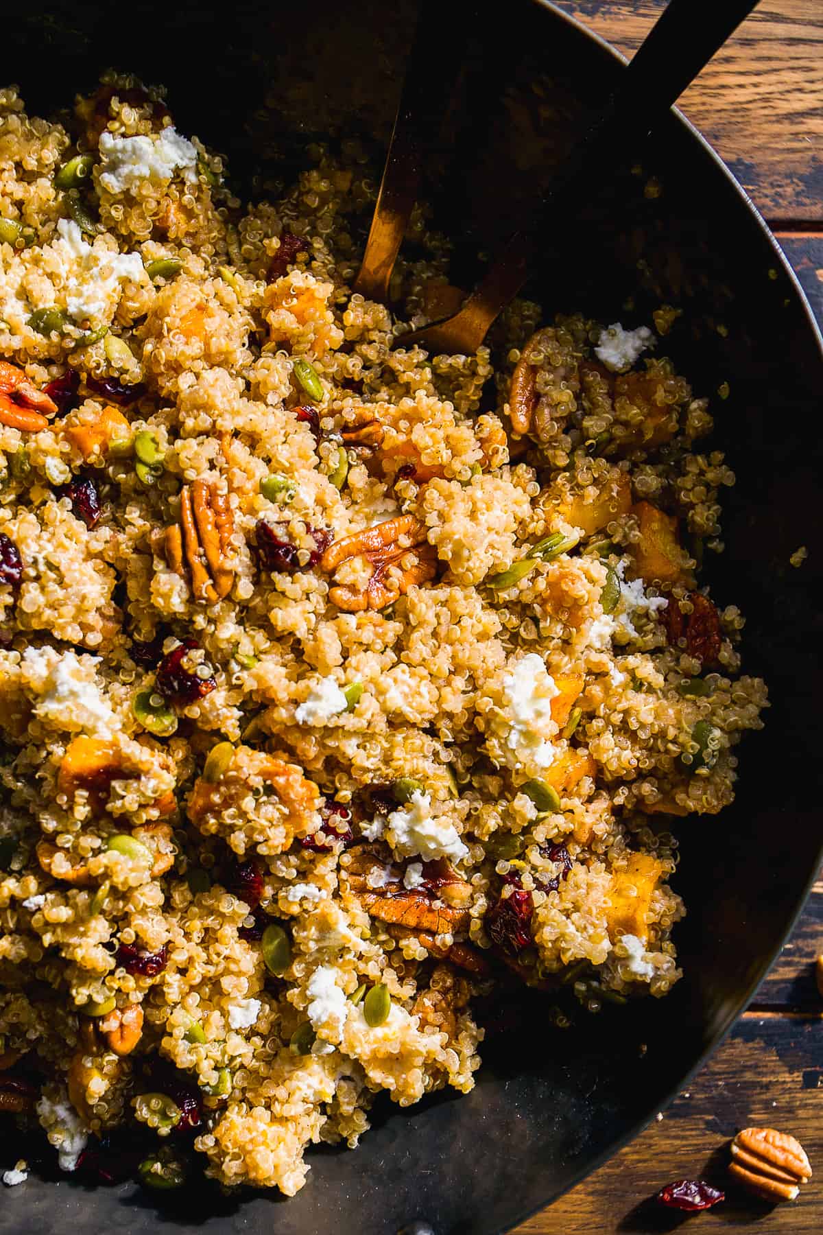 Bowl of pumpkin quinoa salad with goat cheese.