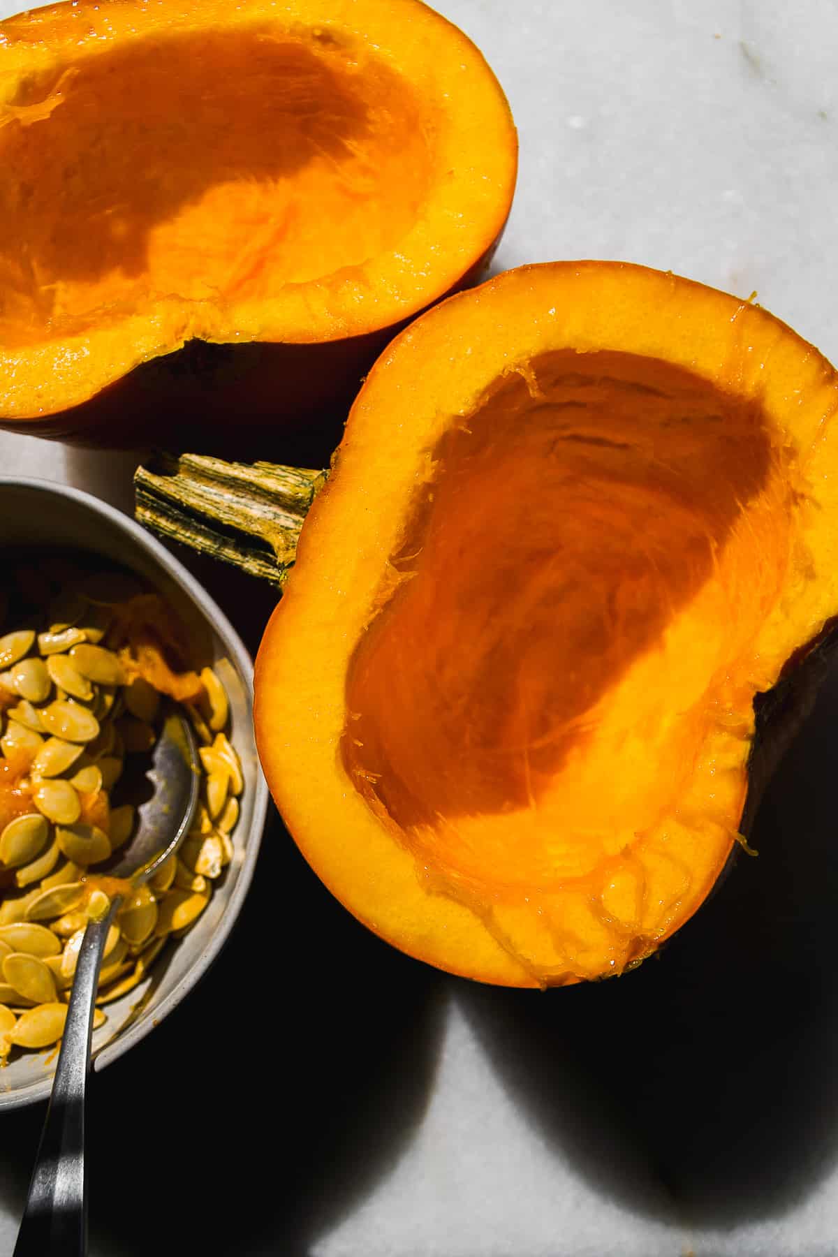 Pumpkin halves with seeds removed.