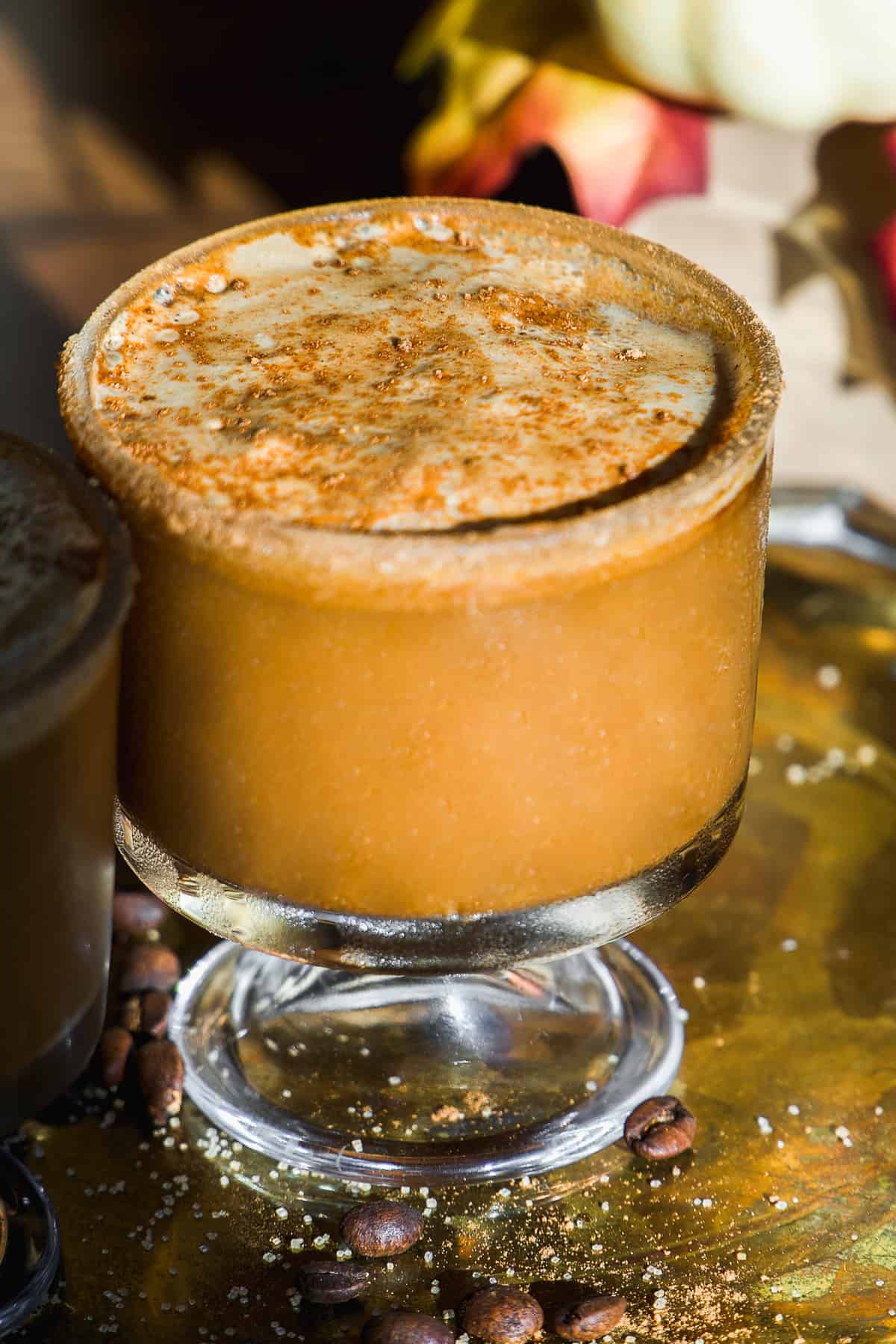 Pumpkin spice espresso martini with cinnamon around the rim.