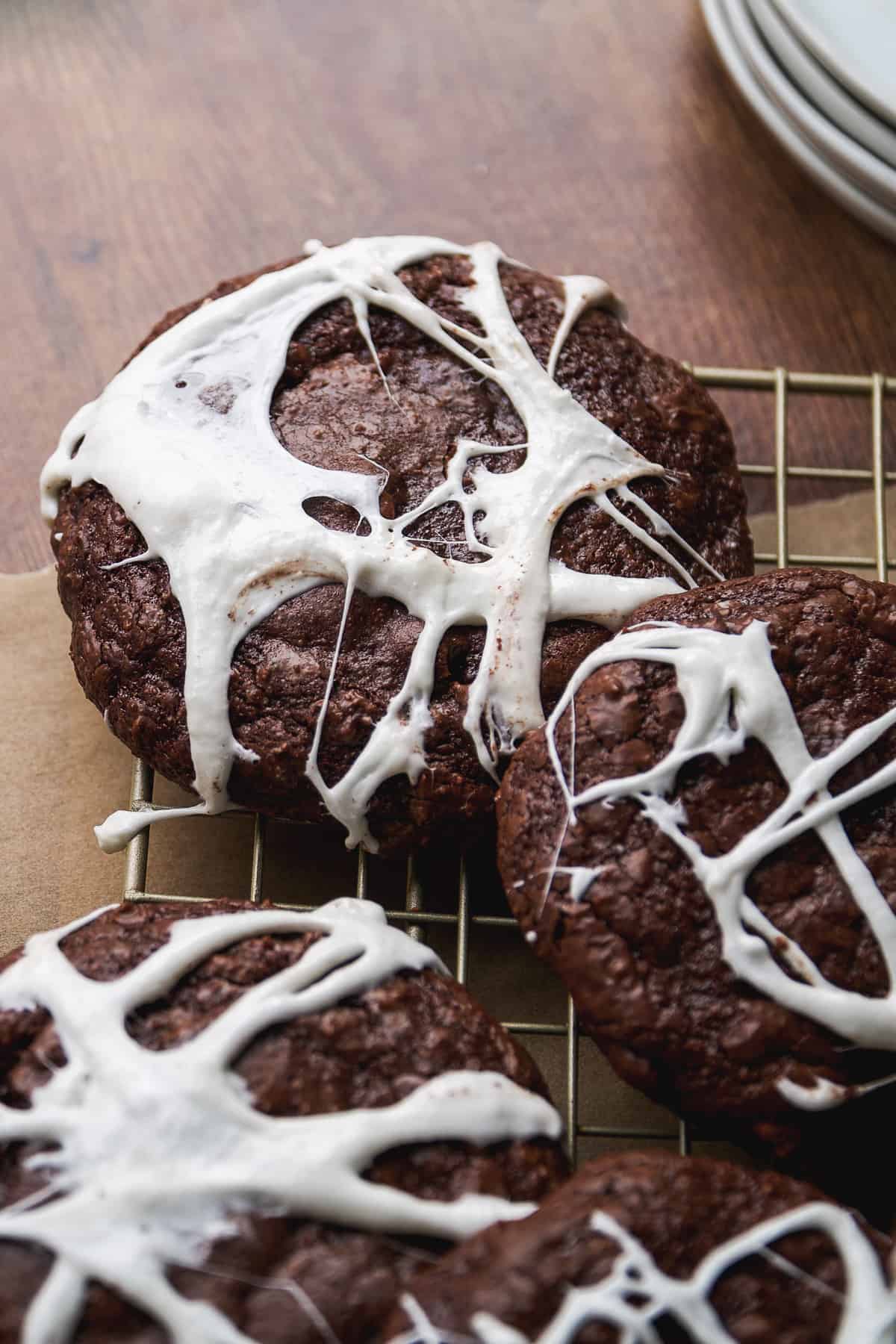 Chocolate cookies with a marshmallow spider web.