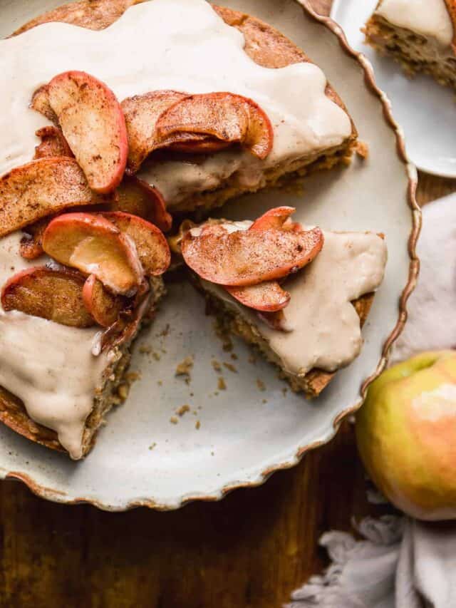 Overhead view of a gluten free apple cake with a slice cut out.