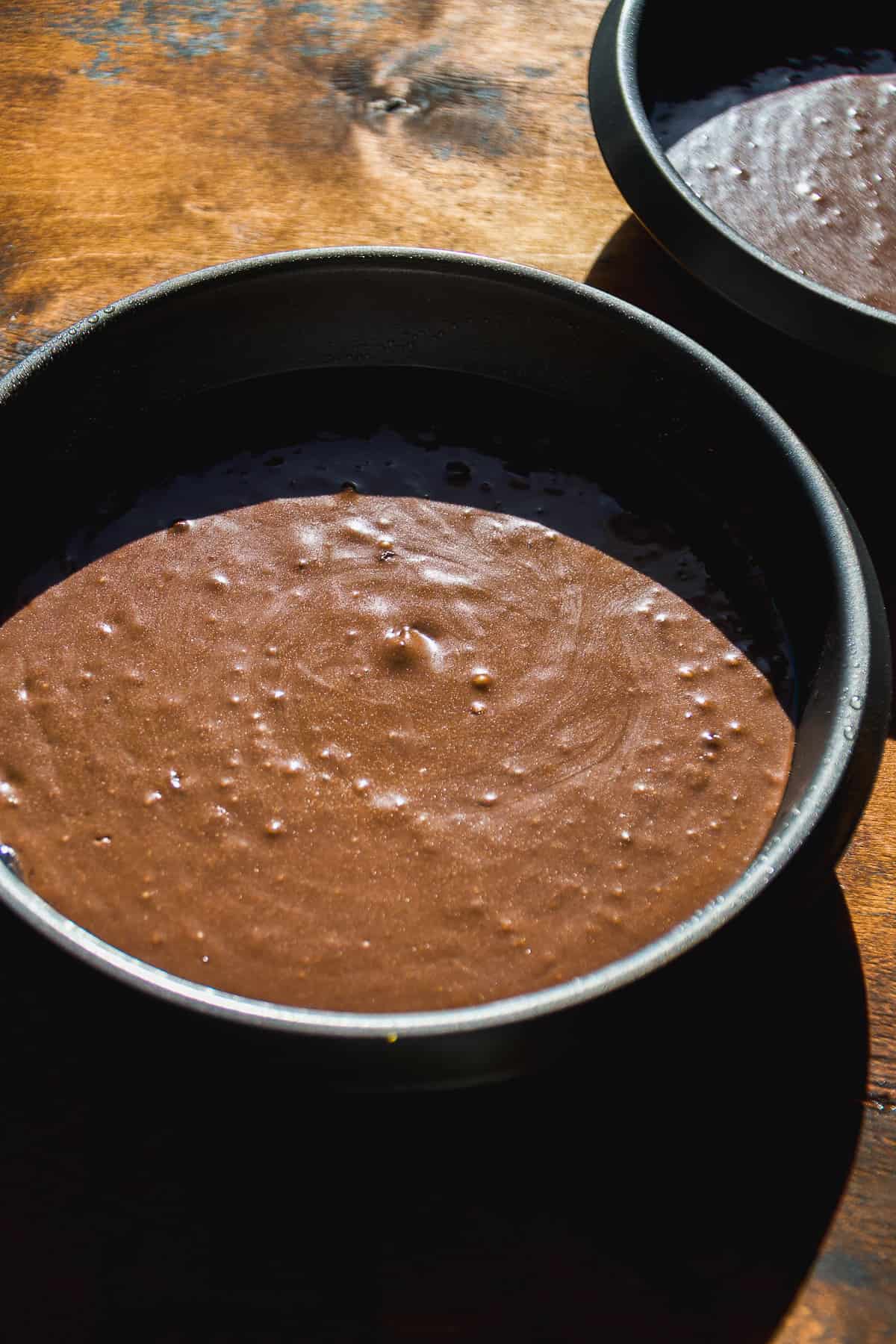 Chocolate orange cake batter about to be baked in a pan.
