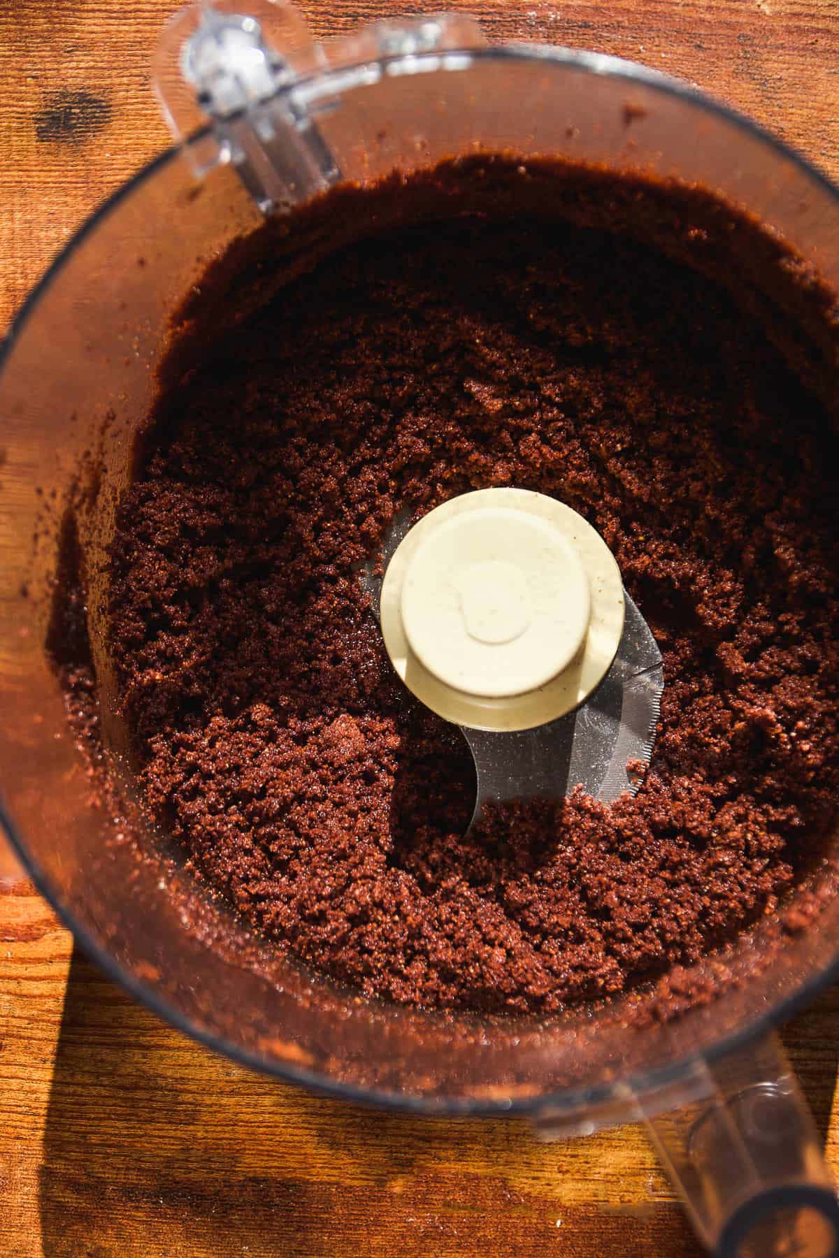 Overhead view of cookies blended up in a food processor.