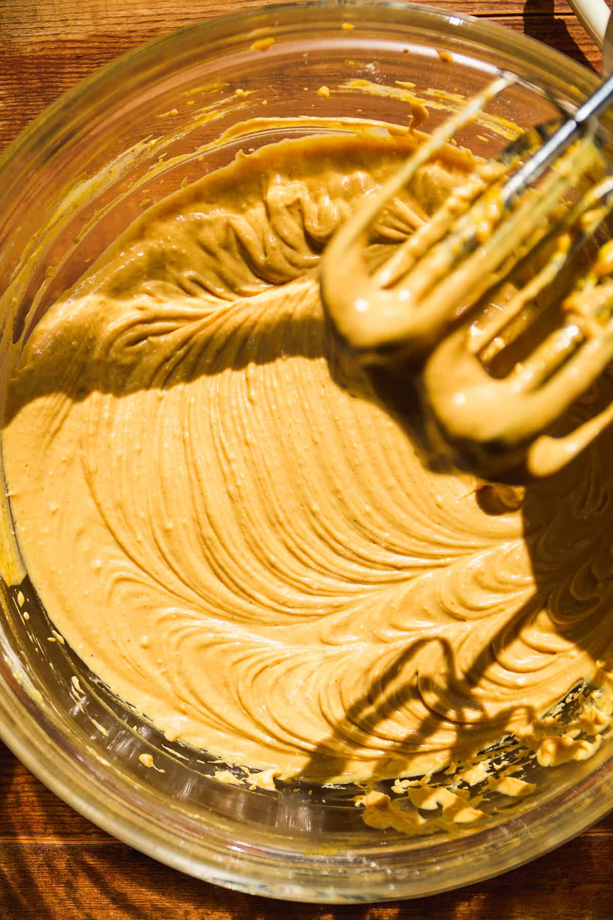 Overhead view of pumpkin cheesecake bater in a bowl.