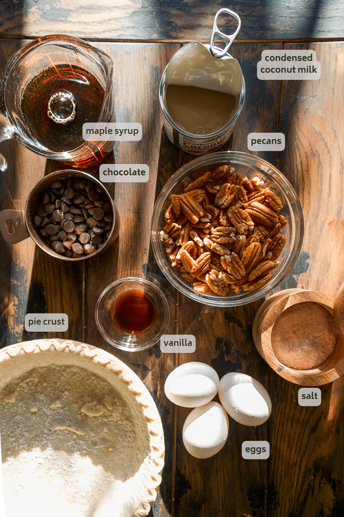 Turtle pie ingredients labeled on a wooden surface.