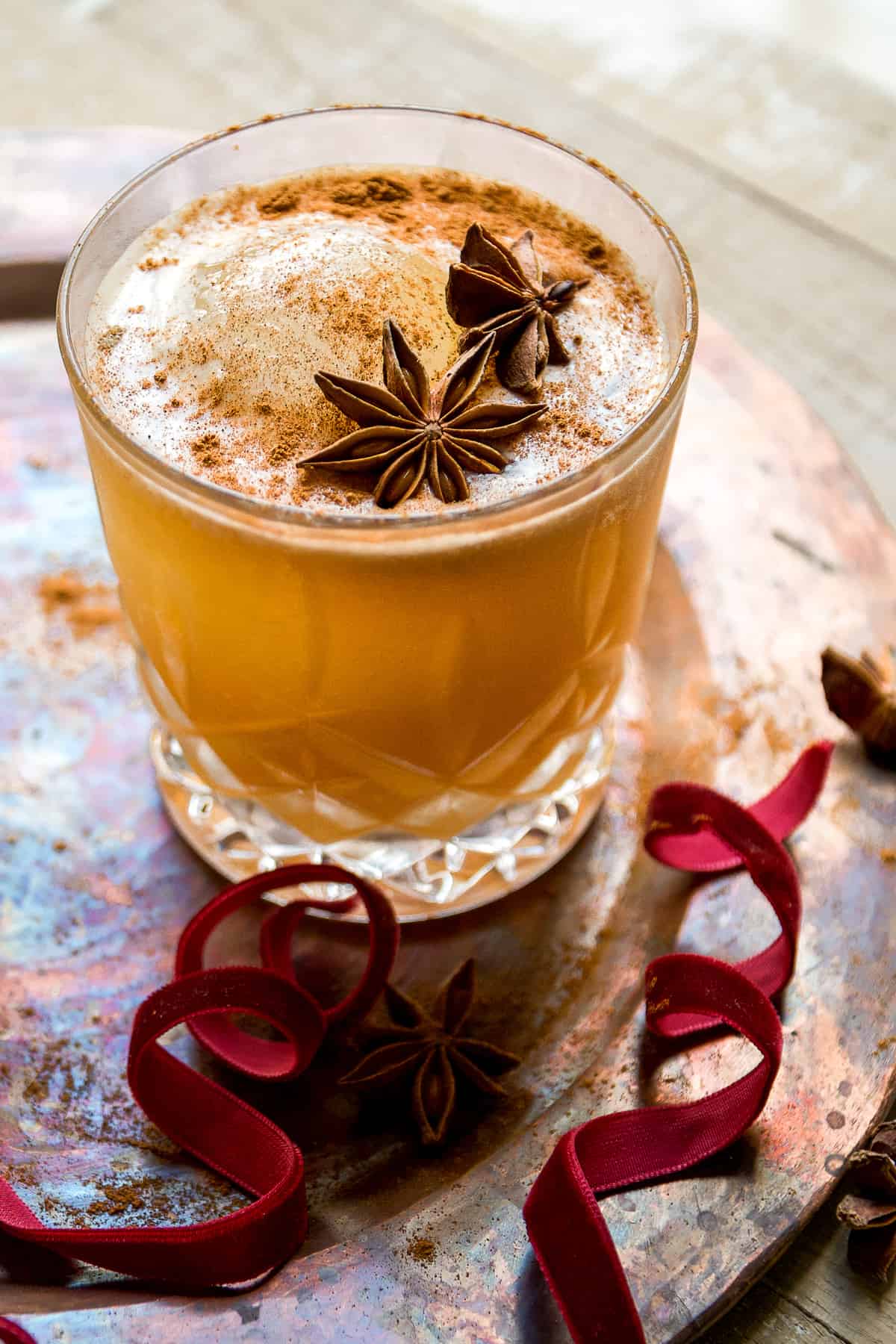 Chai old fashion cocktail with star anise on top.