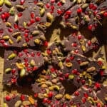 Chocolate Christmas bark with pomegranates and pistachios.