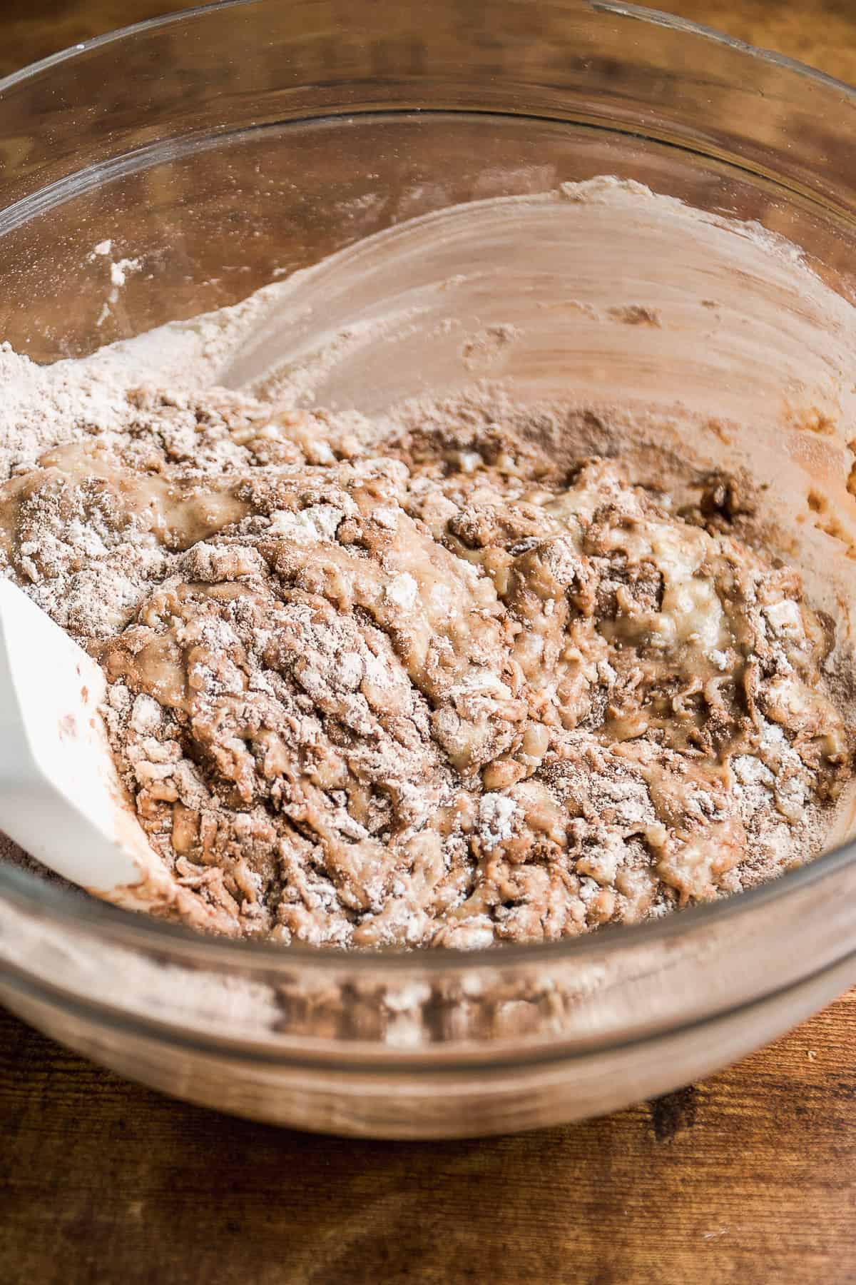 Coffee doughnut batter being mixed in a bowl.